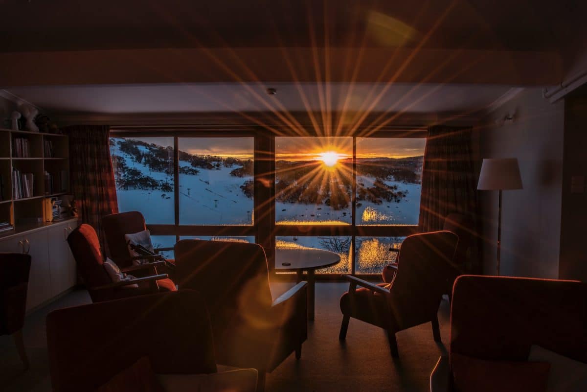 room overlooking a snowy mountain slope